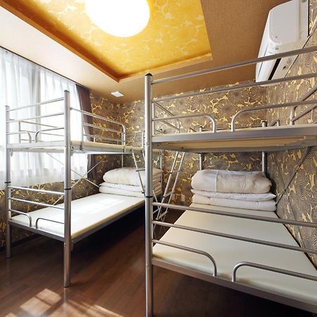 Guesthouse Tiga Кумамото Стая снимка