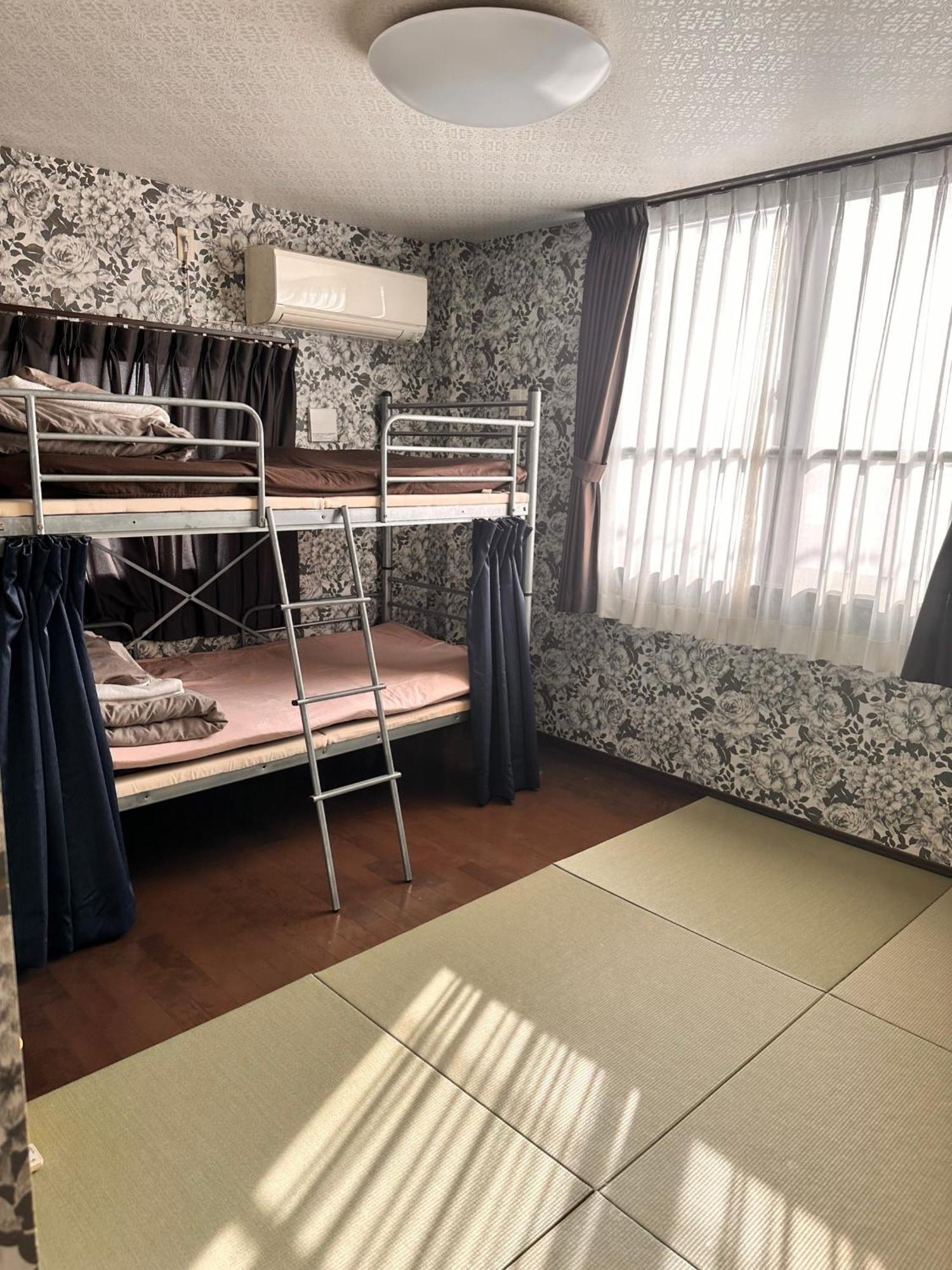Guesthouse Tiga Кумамото Екстериор снимка
