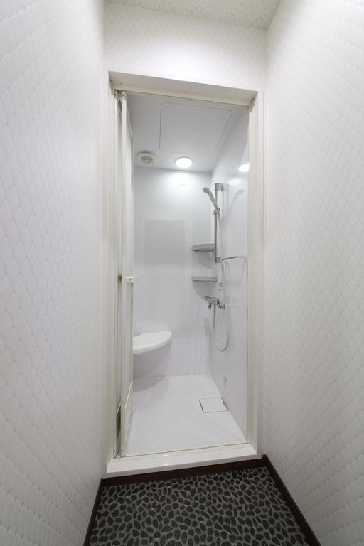 Guesthouse Tiga Кумамото Стая снимка